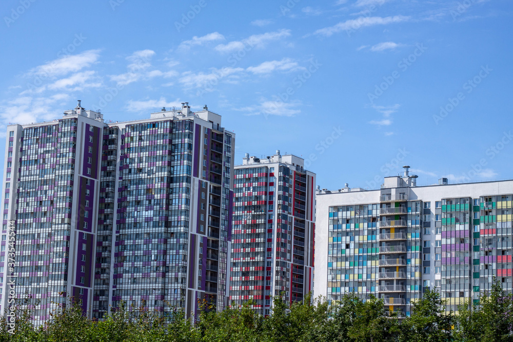 New multi-storey colored house in the city. The family bought the apartment on credit.