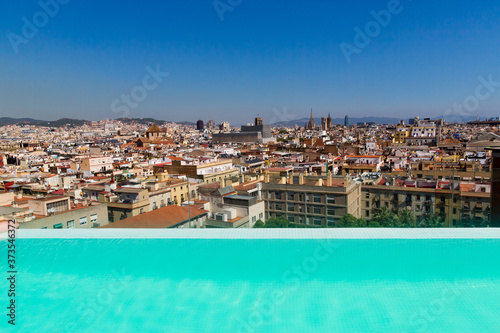 Barcelona, Catalonia, Europe, Spain, September 22, 2019. Top panoramic view of the Barcelona landscape from infinity swimmingpool. Historical buildings in the background.