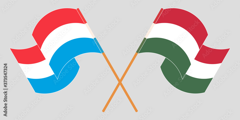 Crossed and waving flags of Luxembourg and Hungary Crossed and waving flags of Luxembourg and Hungary