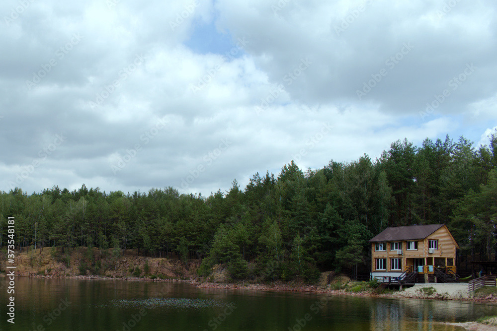 Obraz premium wooden house on the bank