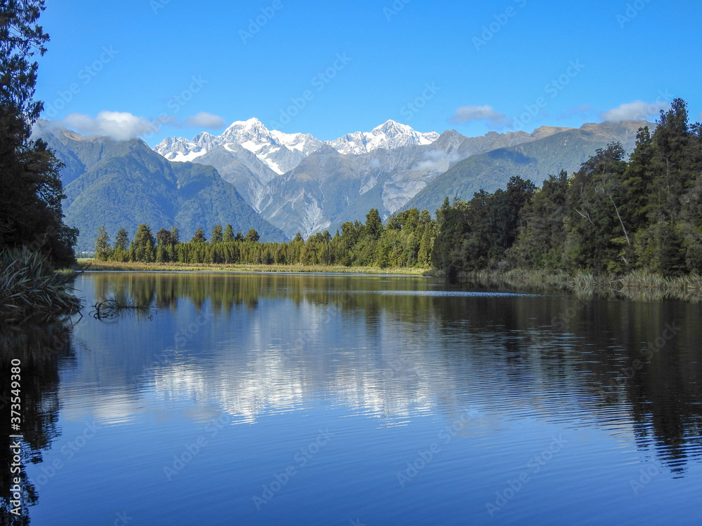 Mt Cook behind a placid lake in New Zealand