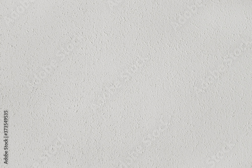 White textured wall with reliefs. Background for designs