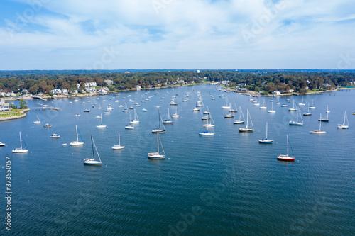 Picturesque coastline with boats floating in marine photo