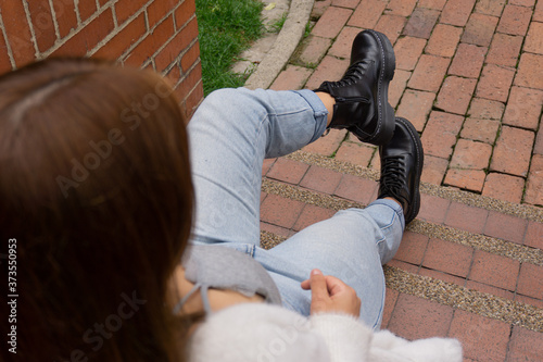 Young woman in leather boots