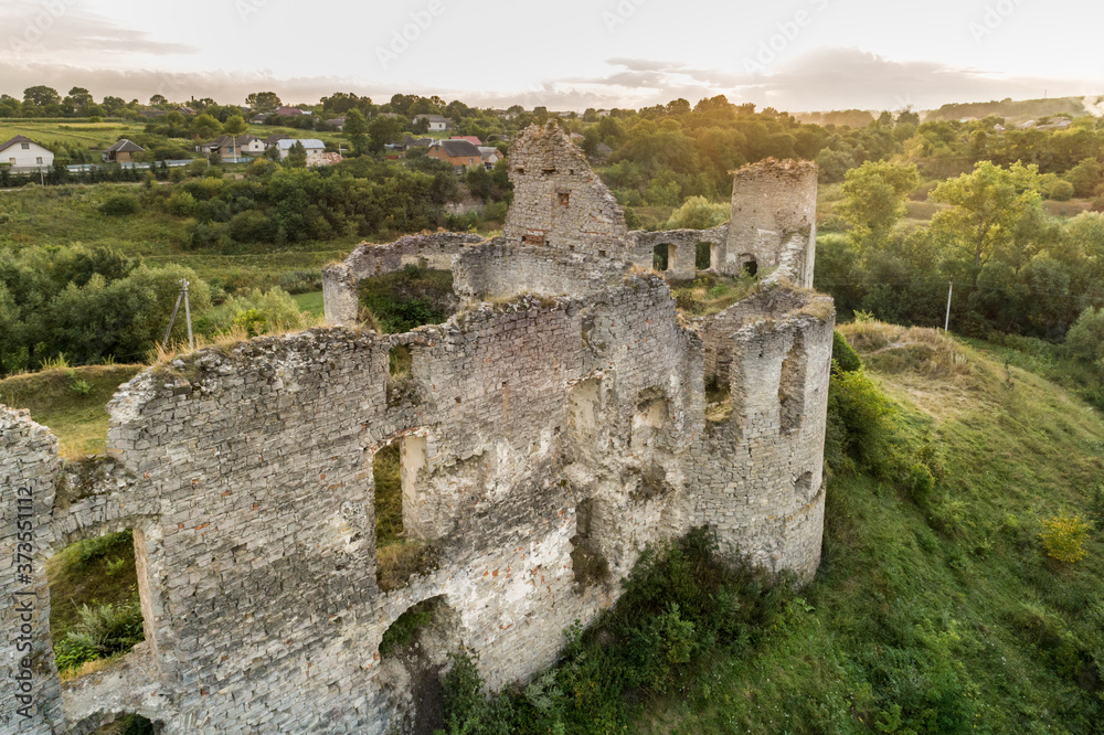 Fototapeta premium Aerial view oа Sydoriv castle ruins in a rural countryside on Sydoriv village, Ternopil region, Ukraine.