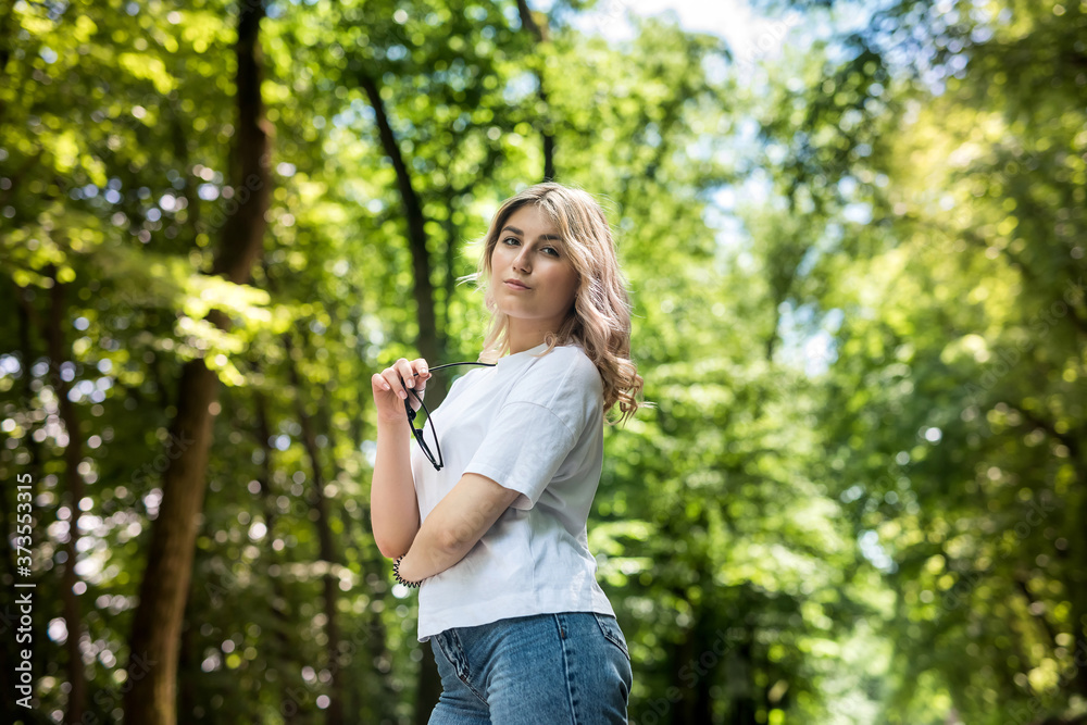 Woman walking at forest and breathing fresh air enjoy free time Woman walking at forest and breathing fresh air enjoy free time
