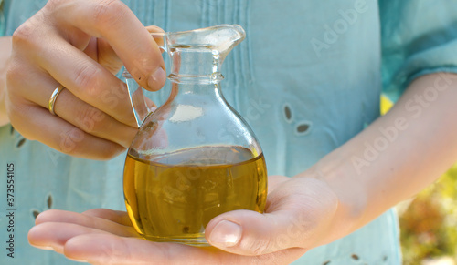 Olive oil in female hands