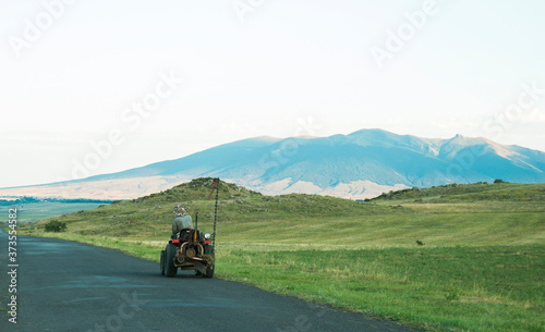 small tractor driving on the road
