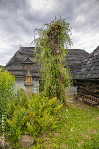 historic wooden rural buildings with an open-air museum in Dobczyce Polish mountains on a summer day