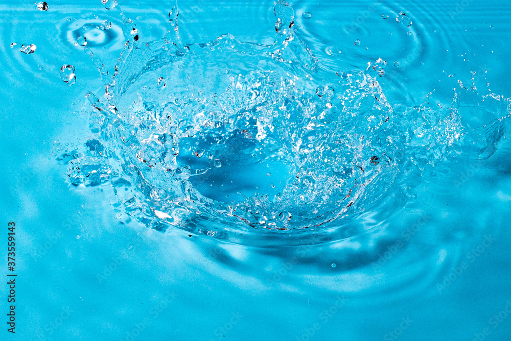 splash of water on a blue background. Abstract wallpaper splash of water on a blue background. Abstract wallpaper