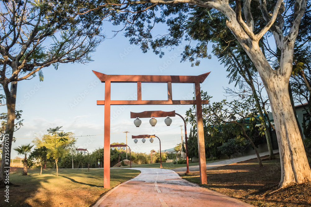 Scenic walking path at the municipal reservoir park in São José do Rio Preto/SP, featuring traditional Japanese lanterns along the route, creating a peaceful and serene atmosphere. Scenic walking path at the municipal reservoir park in São José do Rio Preto/SP, featuring traditional Japanese lanterns along the route, creating a peaceful and serene atmosphere.
