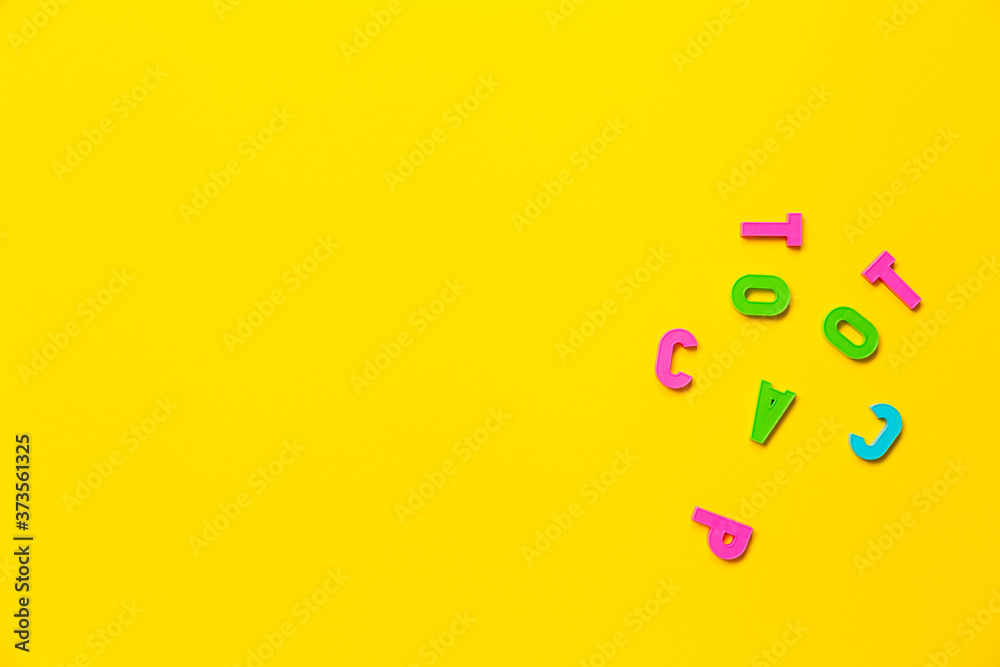Face is depicted using plastic toy colored alphabet letters. Concept of humor that reflects the mood of a student or teacher. Banner with free space for text on the topic of education or psychology Face is depicted using plastic toy colored alphabet letters. Concept of humor that reflects the mood of a student or teacher. Banner with free space for text on the topic of education or psychology