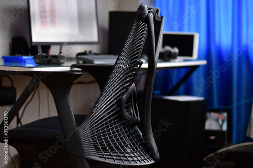 The ultime tecnology devices for a smart home. Wireless devices for videogame play with a confortable gamer chair photo