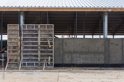 Concrete formwork at a construction site. Installation of reinforced concrete building walls photo