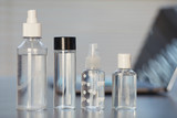 Close up background image of various hand sanitizers on empty workplace desk in post pandemic office, copy space