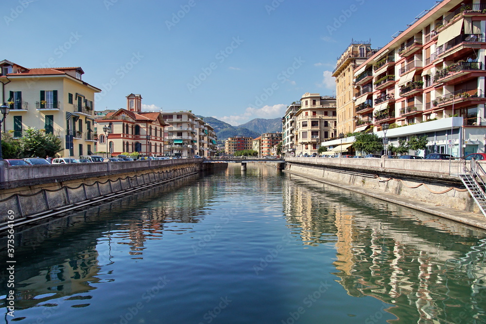 The beautiful Italian town of Rapallo, overlooking the streets of the city with the river, bridges, mountains. The urban landscape in Italy.