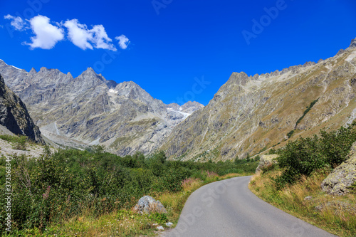 High altitude road in Alps near the Glacier Blanc in the Ecrins Massif in the southern French Alps