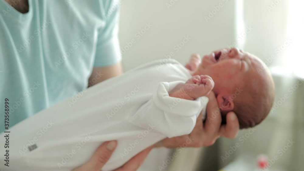 Hungry crying newborn baby boy in the maternity hospital Hungry crying newborn baby boy in the maternity hospital