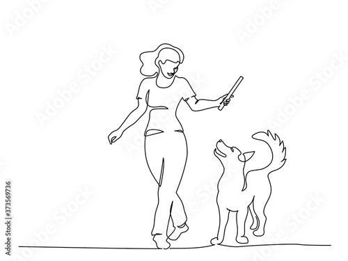Woman training dog with stick. Continuous one line art