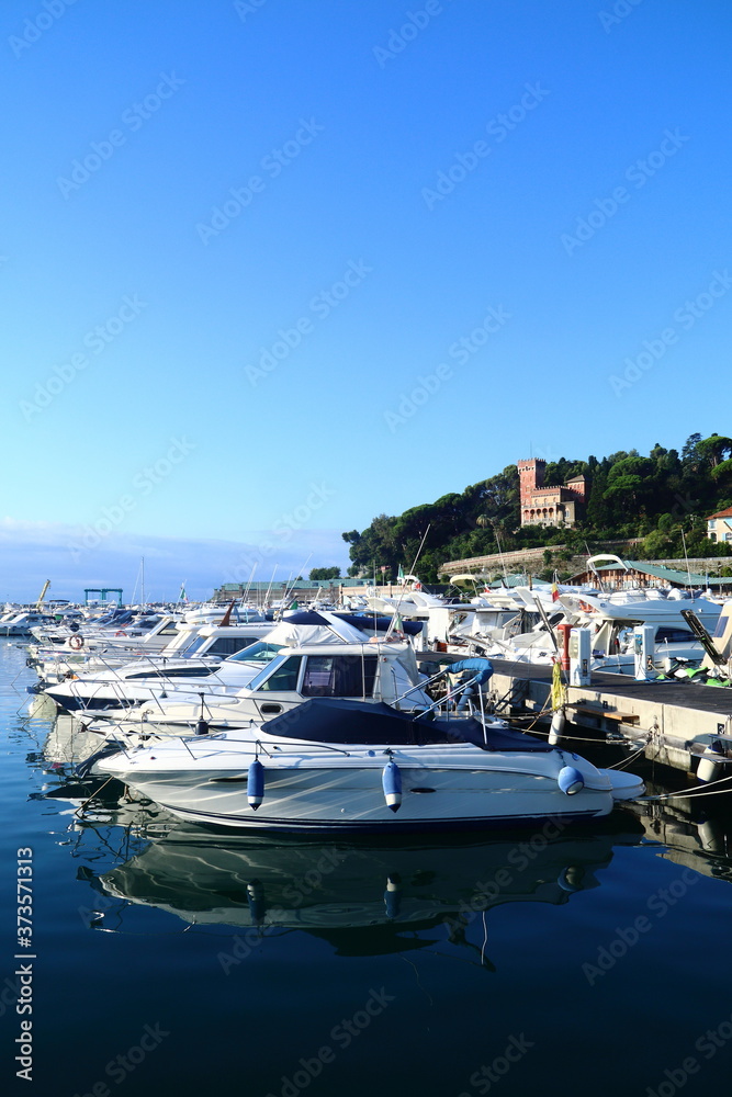 Obraz premium Boats moored inside the tourist port of Varazze.. Varazze is about 30 kilometers from Genoa and makes nautical tourism i