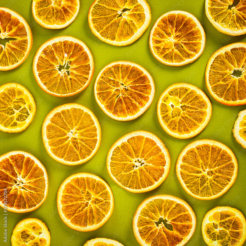 Obraz premium Dry Oranges Slices Snack. Dry Oranges for Christmas Decorations. Selective focus.