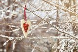 Christmas Background. Felt Red Heart on a Natural Background. Selective focus.