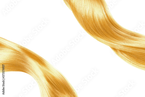 Blond shiny hair isolated on white. Background with copy space