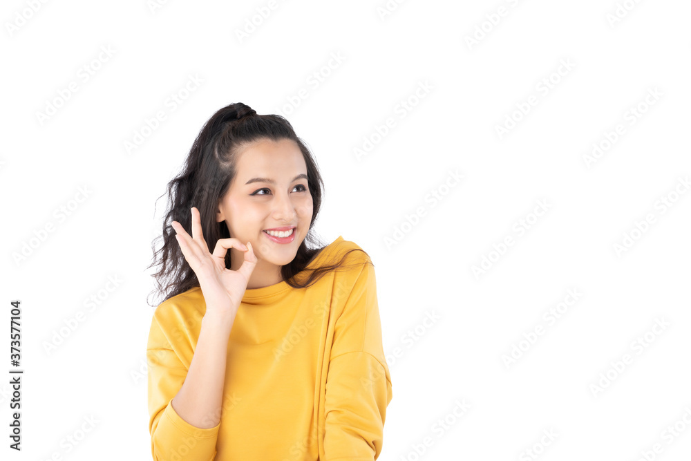 Asian young woman showing okay gesture on isolate white background Asian young woman showing okay gesture on isolate white background