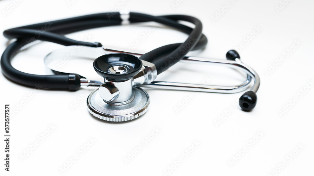 Black Stethoscope and phonendoscope isolated on white close up. Selective focus. Medical concept. Black Stethoscope and phonendoscope isolated on white close up. Selective focus. Medical concept.