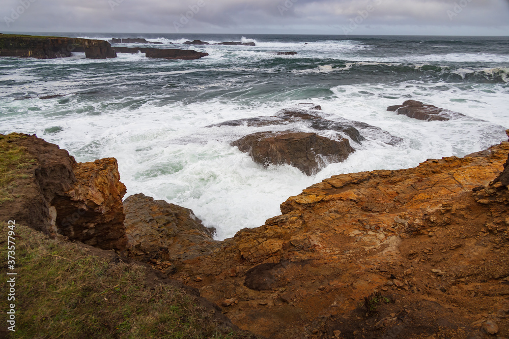 Waves breaking on California coastline 