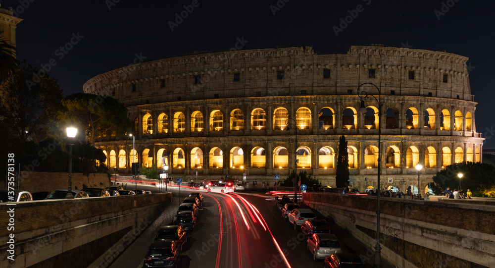 View of the Colosseum from the street at night