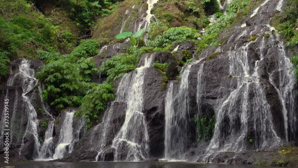 Pucak Manik Waterfall hidden in tropical rainforest jungle island Bali, Indonesia. 4K