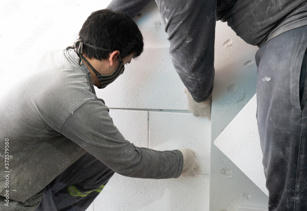 installation of gypsum boards on the wall in the apartment installation of gypsum boards on the wall in the apartment