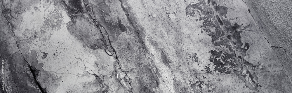 Panoramic background - old dark concrete wall with cracks Panoramic background - old dark concrete wall with cracks