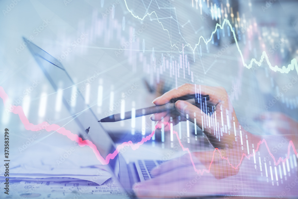 Multi exposure of woman hands typing on computer and financial graph hologram drawing. Stock market analysis concept. Multi exposure of woman hands typing on computer and financial graph hologram drawing. Stock market analysis concept.