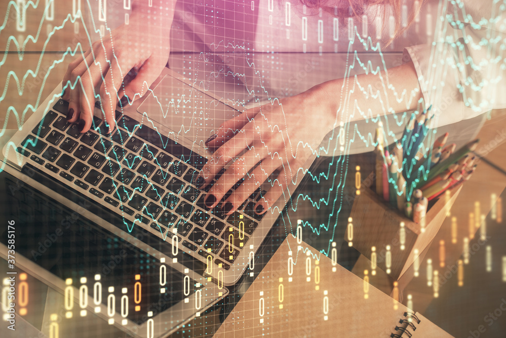 Double exposure of woman hands typing on computer and forex chart hologram drawing. Stock market invest concept. Double exposure of woman hands typing on computer and forex chart hologram drawing. Stock market invest concept.