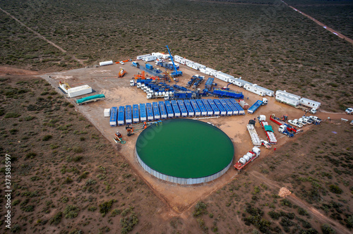 Vaca Muerta  Argentina  July 30  2013  Extraction of unconventional oil. Battery of pumping trucks for hydraulic fracturing  Fracking .