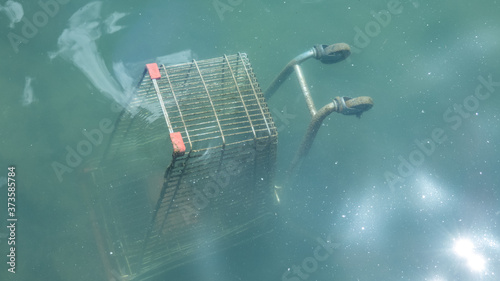 Wreck of abandoned shopping cart at sea