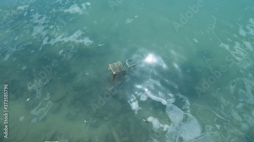 Shopping cart wreck abandoned at sea waiting to be rescued
