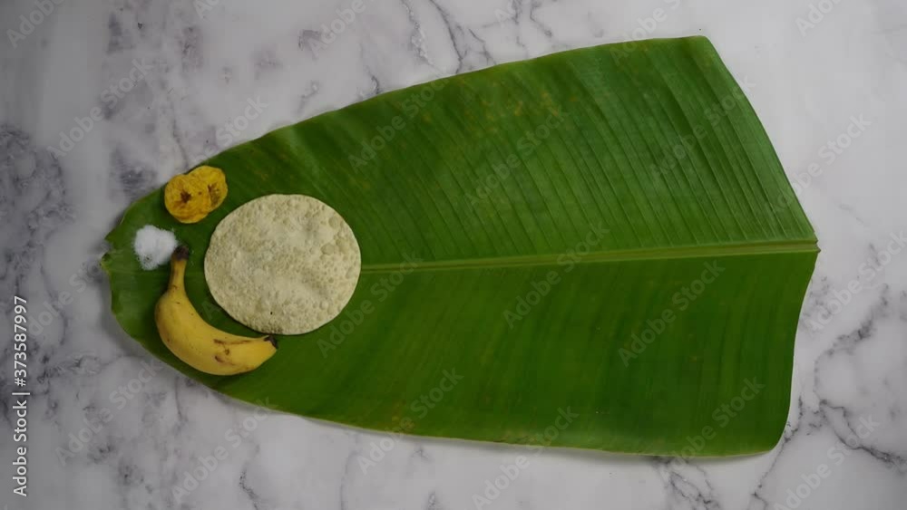 Serving Sadya / meal on a banana leaf for Kerala Onam festival in stop motion animation