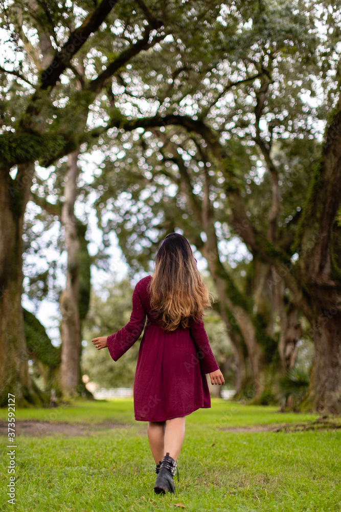 A girl walking around in nature in New Orleans, Louisiana A girl walking around in nature in New Orleans, Louisiana