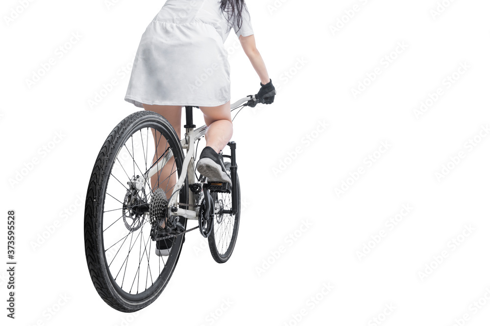 Fototapeta premium Rear view of a woman riding a bicycle