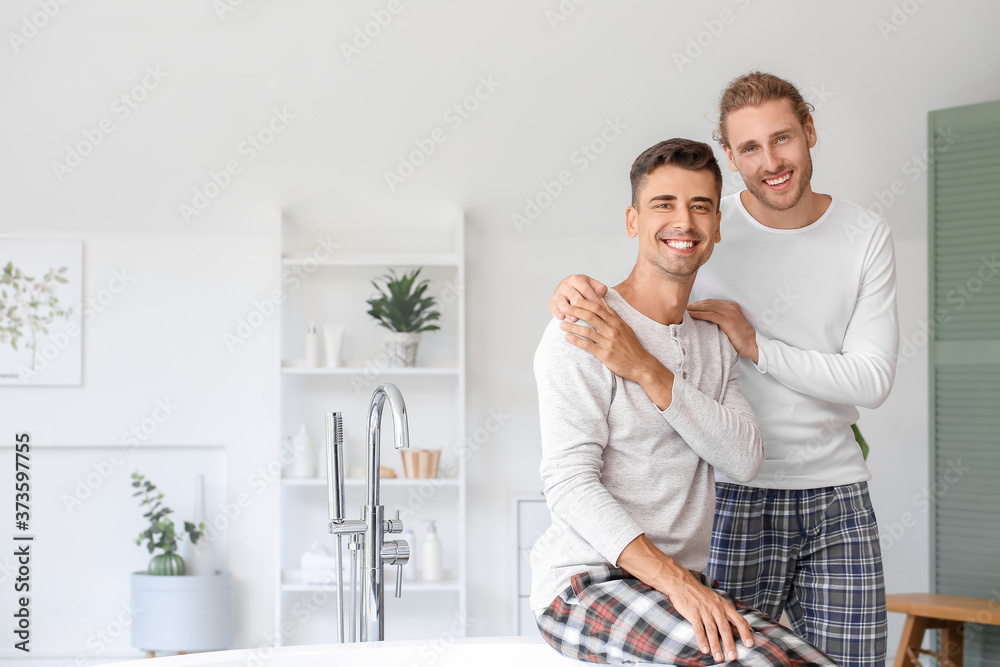 Happy gay couple in bathroom