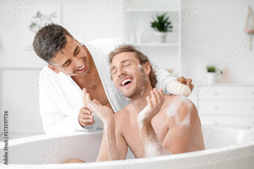 Happy gay couple spending t...