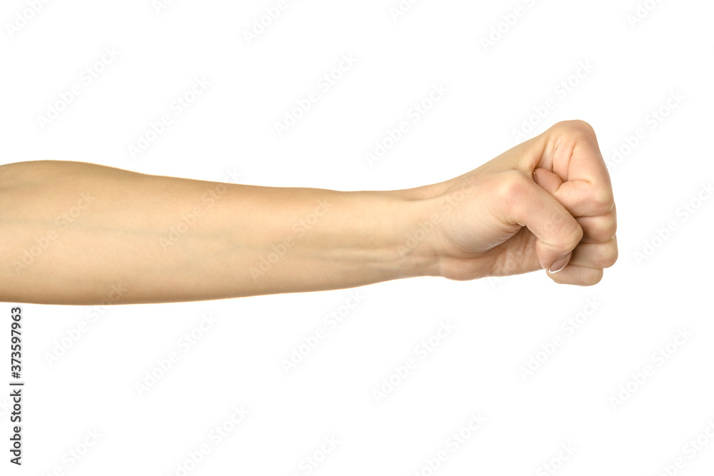 Hand clenched in a fist. Woman hand gesturing isolated on white Hand clenched in a fist. Woman hand gesturing isolated on white