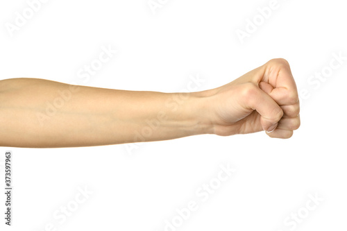 Hand clenched in a fist. Woman hand gesturing isolated on white