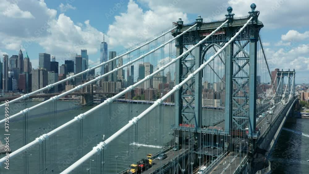 daytime flying alongside Manhattan Bridge towards downtown NYC