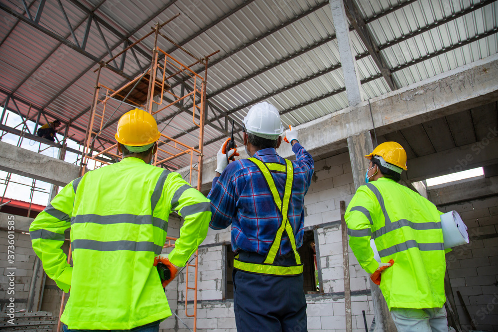 Asian engineer technician team inspector of workers to productivity build a house in the construction site Asian engineer technician team inspector of workers to productivity build a house in the construction site