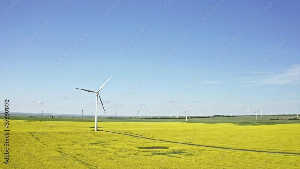 Wind farm, wind turbines in Saskatchewan Canada. Crane up aerial shot. Wind farm, wind turbines in Saskatchewan Canada. Crane up aerial shot.