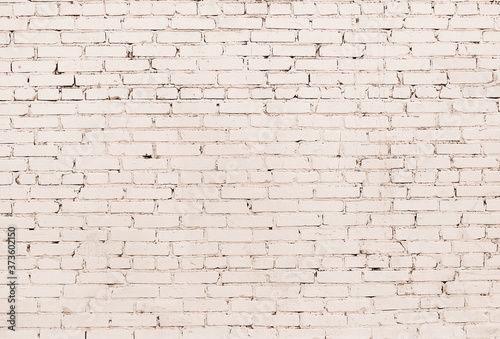 Beige grunge brick wall background. Empty texture